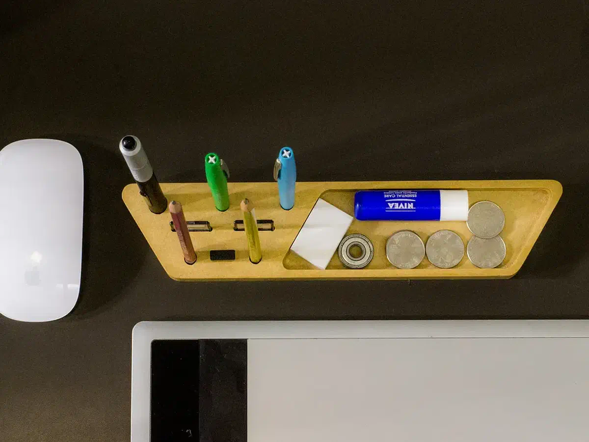 Finished yellow MDF organizer holding pens, markers, storage cards, and a USB device