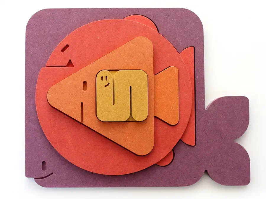 Purple whale, red round fish, orange triangular fish and yellow worm nested together as a wooden puzzle