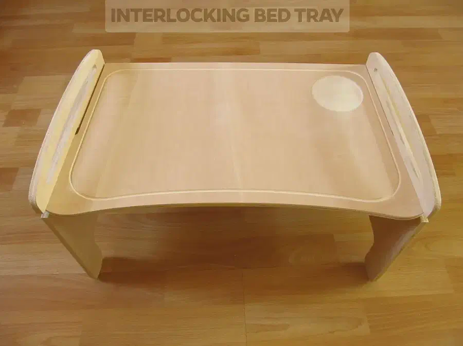 A plywood bed tray with interlocking legs and raised sides